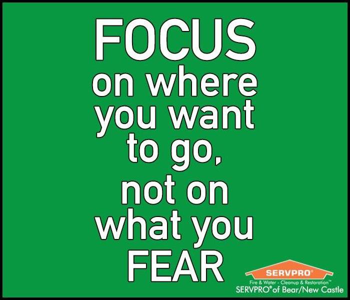 Text of the quote "Focus On Where You Want To Go, Not On What You Fear" on a green background