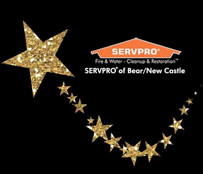 SERVPRO of Bear/New Castle's logo with gold glitter stars 