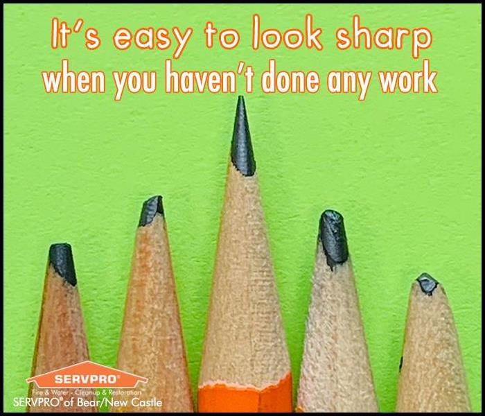 Image of 5 pencils, one sharp and 4 dull, with a green background