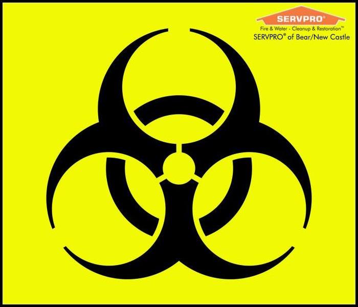 Biohazard symbol on yellow background